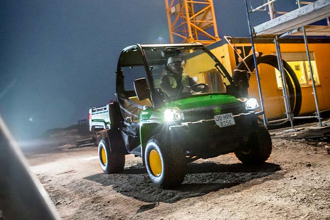 Engineer driving a vehicle arround the construction site