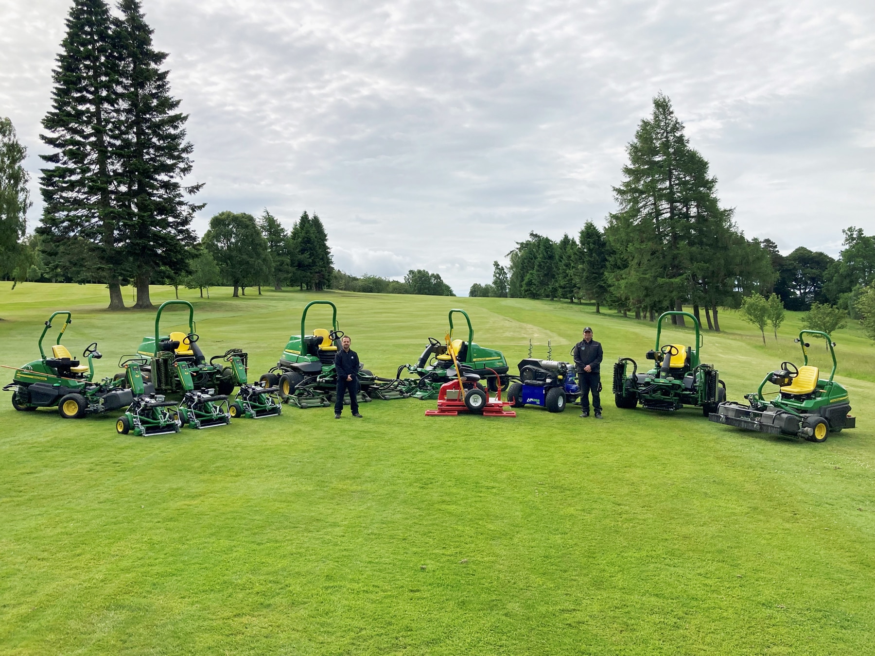 Dunblane New Golf Club course manager Wes Saunders (right) with John Deere dealer Double A golf key accounts manager John Bateson and the new course maintenance equipment fleet.