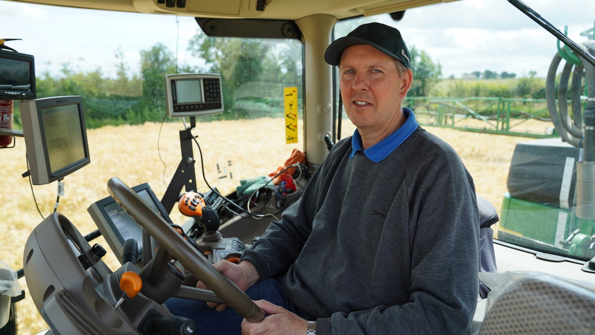 Steve May pulls the John Deere R962i with a 6215R AutoPowr