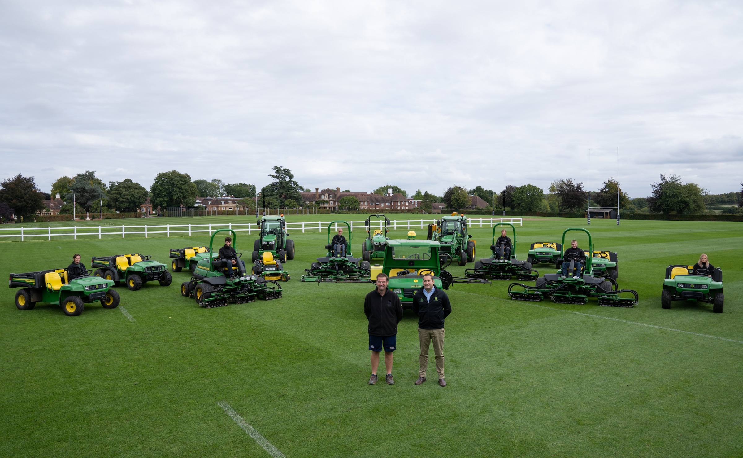 Alistair Cotton (left), Head Groundsman at Lord Wandsworth College, and Ed Smales, Director at John Deere dealer Hunt Forest Group, with the new fleet