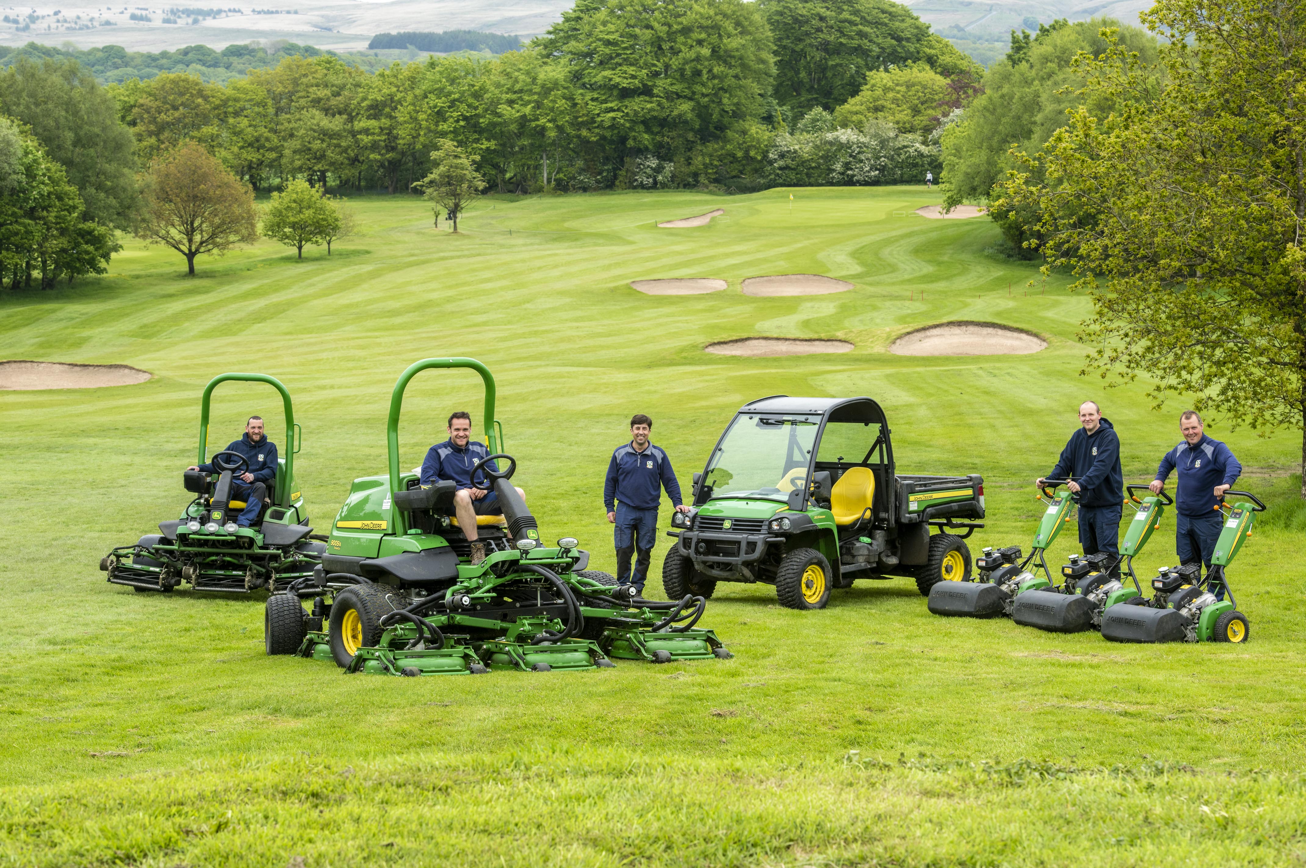 Members of the greenkeeping team at Chorley display the new John Deere machinery they are now using. 