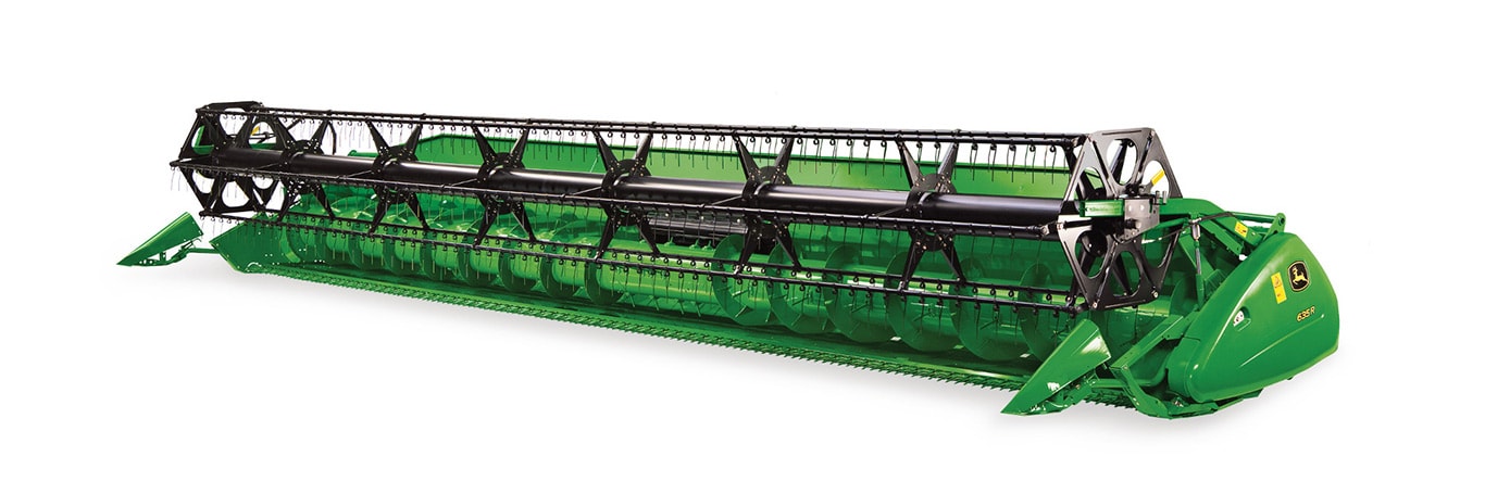 Retractable fingers are positioned over the full width of the auger for smooth, even feeding. Retainers prevent any broken fingers from entering the combine.